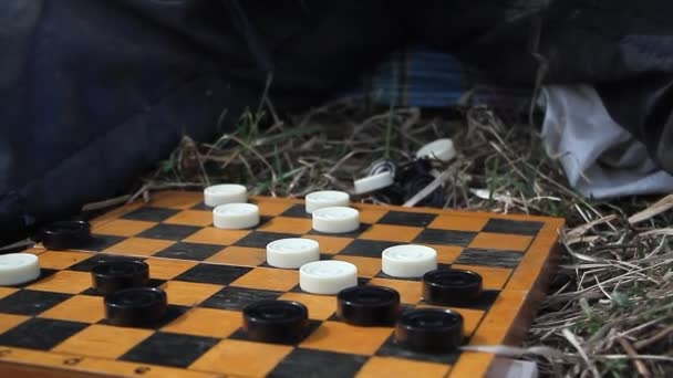 Closeup Old Hands Playing Checkers According Scheme Newspaper Nature Shepherd — Stock Video
