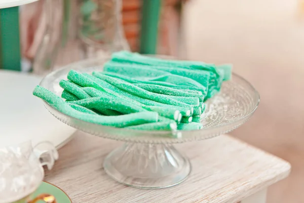 Fruit sweets on a glass stand, candy and oriental sweets, treat at a summer picnic, selective focus — Stock Photo, Image