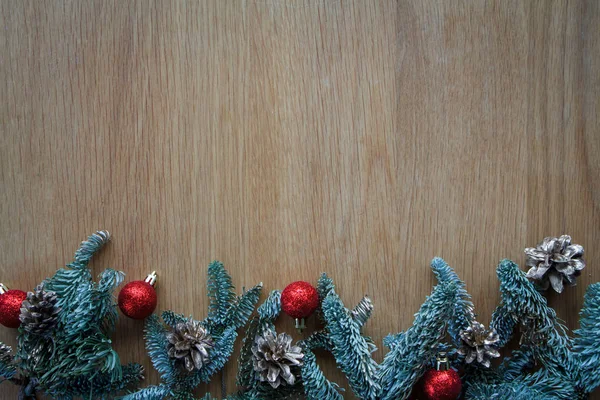 Top view fir branch with Christmas decorations on wooden shabby background with copy space for text, soft focus — Stock Photo, Image