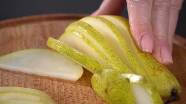 Cut the pear into thin pieces. slow motion — Stock Video