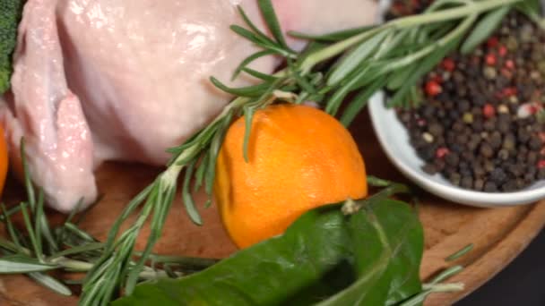 Chicken whole with tangerines on the table — Stock Video