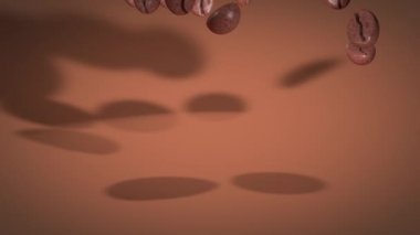 Kahve çekirdekleri kahverengi arka plana düşer