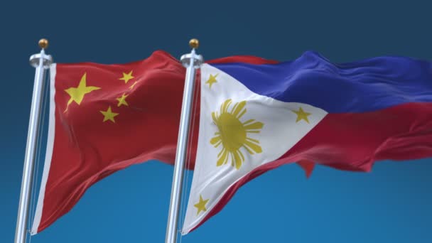 4k Dikişsiz Filipinler ve Çin Bayrakları mavi gökyüzü arka plan ile, Phi Ph Chn Cn. — Stok video