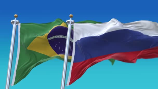 4k zökkenőmentes Brazília és Oroszország zászlók kék ég háttér, melltartó br RUS ru. — Stock videók