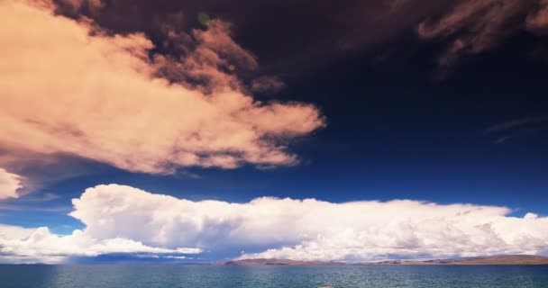 4k timelapse huge clouds mass rolling over lake namtso & snow mountain in tibet — Stock Video