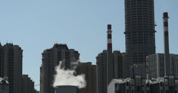 4k fumes billow & smoke from industry chimney,urban building background. — Stock Video