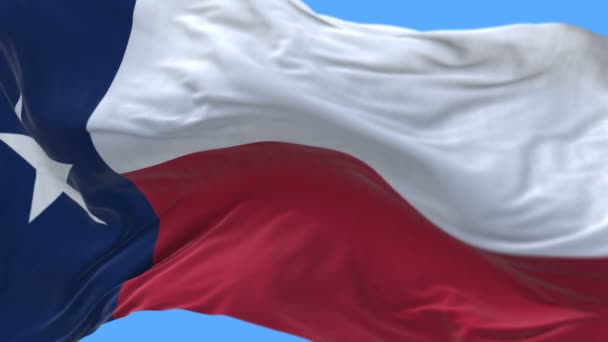 4k naadloze close-up van Texas vlag langzaam zwaaien in de wind. alfakanaal opgenomen. — Stockvideo