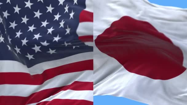 4k Vereinigte Staaten von Amerika USA und Japan Nationalflagge weht im Hintergrund. — Stockvideo