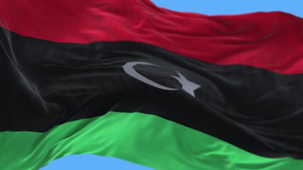4k Λιβύη Εθνική σημαία ρυτίδες κυματίζει τον ουρανό αέρα αδιάλειπτη βρόχο φόντο. — Αρχείο Βίντεο