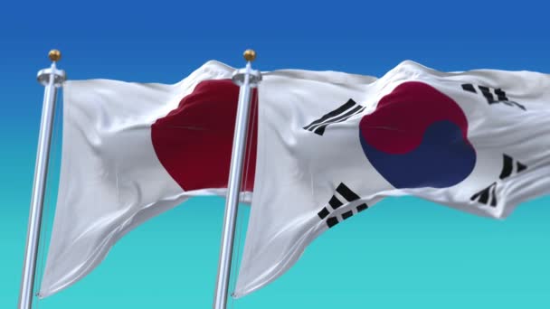 4k Kusursuz Japonya ve Kore Cumhuriyeti Mavi gökyüzü arkaplanlı bayraklar, JP. — Stok video