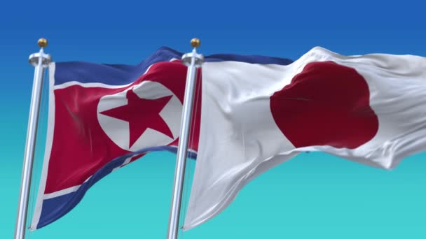 4k Płynne flagi Japonii i Korei Północnej z niebieskim tle nieba, JP. — Wideo stockowe