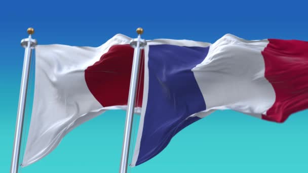 4k Naadloze Japan en Frankrijk Vlaggen met blauwe lucht achtergrond, JP. — Stockvideo