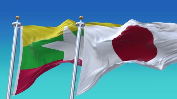 4k Płynne flagi Japonii i Związku Myanmar z niebieskim tle nieba, JP. — Wideo stockowe