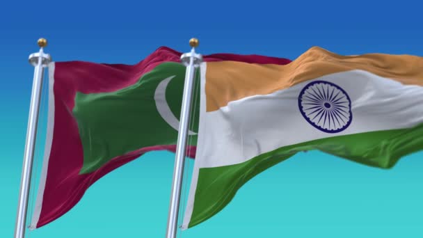 4k Безшовные Индии и Мальдив Флаги с голубым небом фоне, JP, IND. — стоковое видео