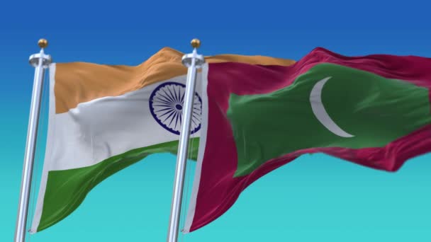 4k Płynne Indie i Malediwy Flagi z niebieskim tle nieba, JP, IND. — Wideo stockowe