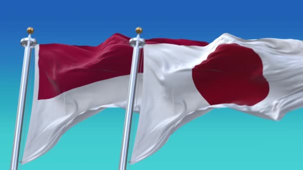 4k Płynne flagi Japonii i Indonezji z niebieskim tle nieba, JP. — Wideo stockowe