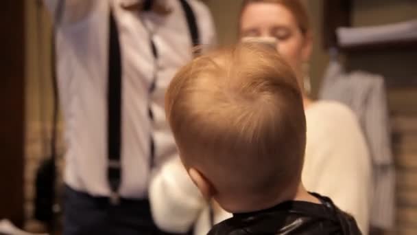 A small child dry hair dryer after haircut — Stock Footage A small child dry hair dryer after haircut Video Clip