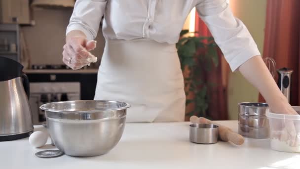 Woman hands at work mixing dough on the counter — Stock Video