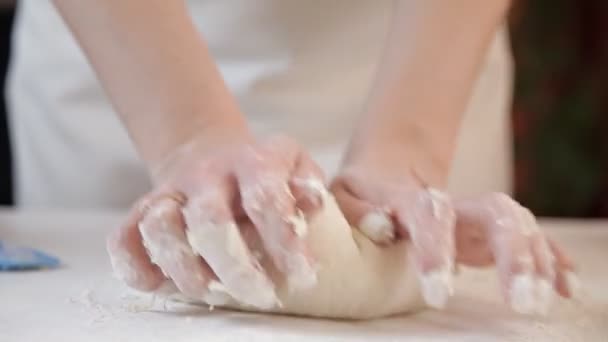 Woman hands at work mixing dough on the counter — Stock Video