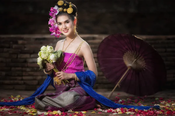 Portrait of Beautiful rural thai woman wear thai dress in Chiang Mai, Thailand