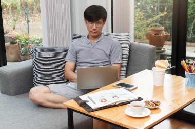 Work from home,Businessman working remotely from home. Using computer. Distance learning online education and work