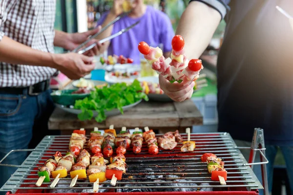 Close up barbecue grill with various kinds of meat.