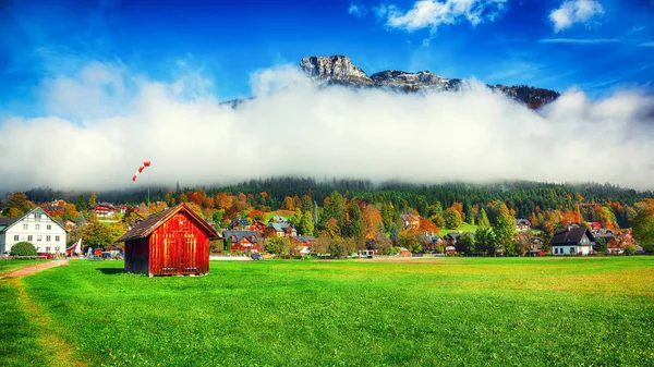 sunny morning on Altaussee village. Sunny autumn scene in the morning. Location: resort village Altaussee, Liezen District of Styria, Austria, Alps. Europe.