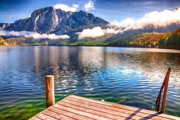 Sunny morning on the lake Altausseer See. Sunny autumn scene in the morning. Location: resort Altausseer see, Liezen District of Styria, Austria, Alps. Europe.