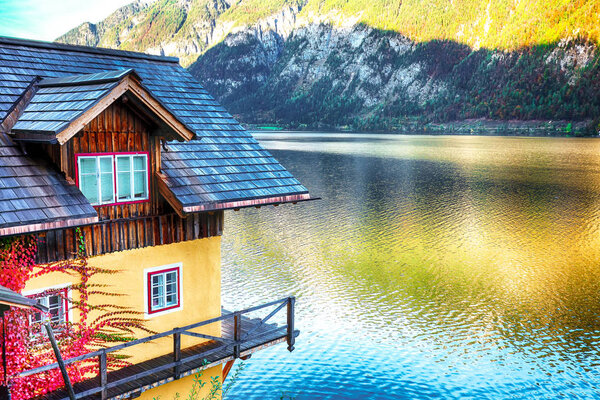 Wooden house on the coast of lake in Hallstatt village Austrian Alps. Location: resort village Hallstatt, Salzkammergut region, Austria, Alps. Europe.