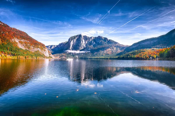 Sunny morning on the lake Altausseer See. Sunny autumn scene in the morning. Location: resort Altausseer see, Liezen District of Styria, Austria, Alps. Europe.