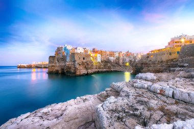 Sunset at Cala Paura gulf in Polignano a Mare