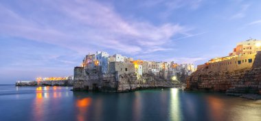 Sunset at Cala Paura gulf in Polignano a Mare