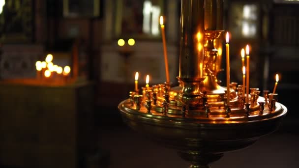 Golden candlestick with burning candles — Stock Video