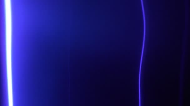 Plasma tube with blue glowing lightning in the dark on exhibition, closeup. — Stock Video