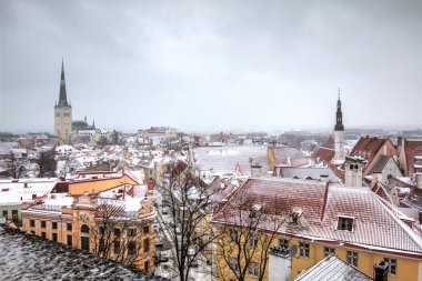 Cityscape with Medieval Old Town, St. Olaf Baptist Church, Tallinn, Estonia. Beatiful winter view of Tall clipart