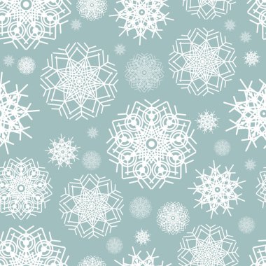 Mavi zemin üzerinde kusursuz kar taneleri deseni