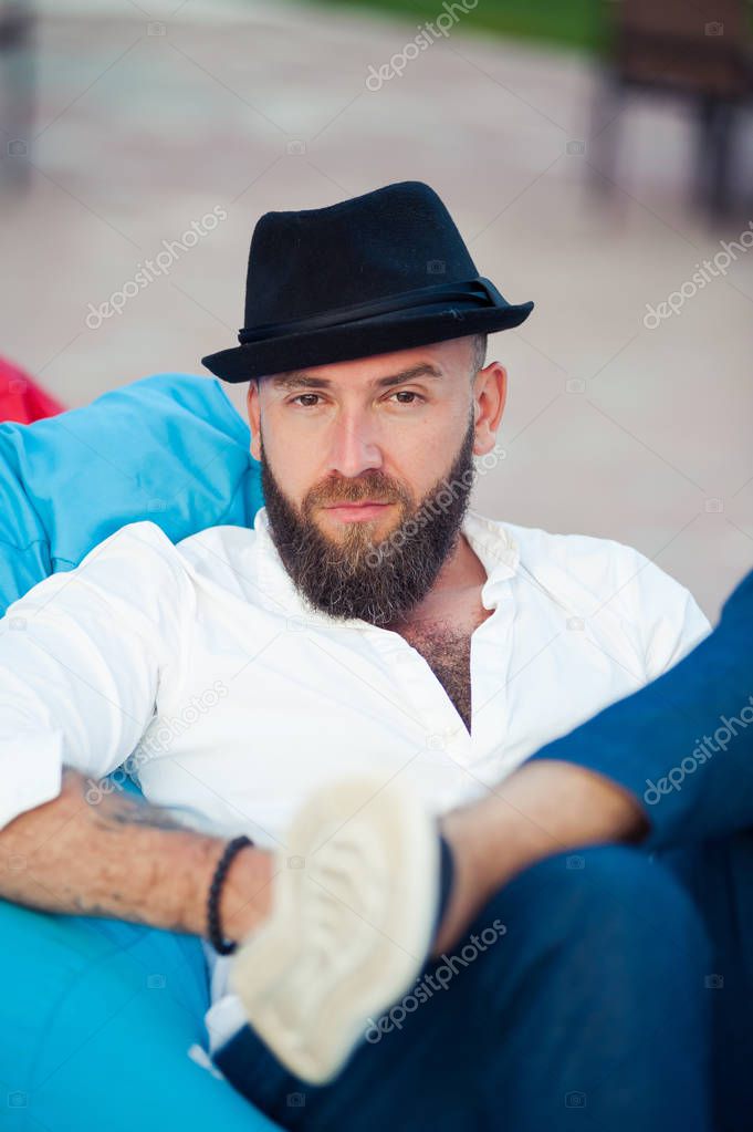 Stylish bearded man in hats. Men`s style