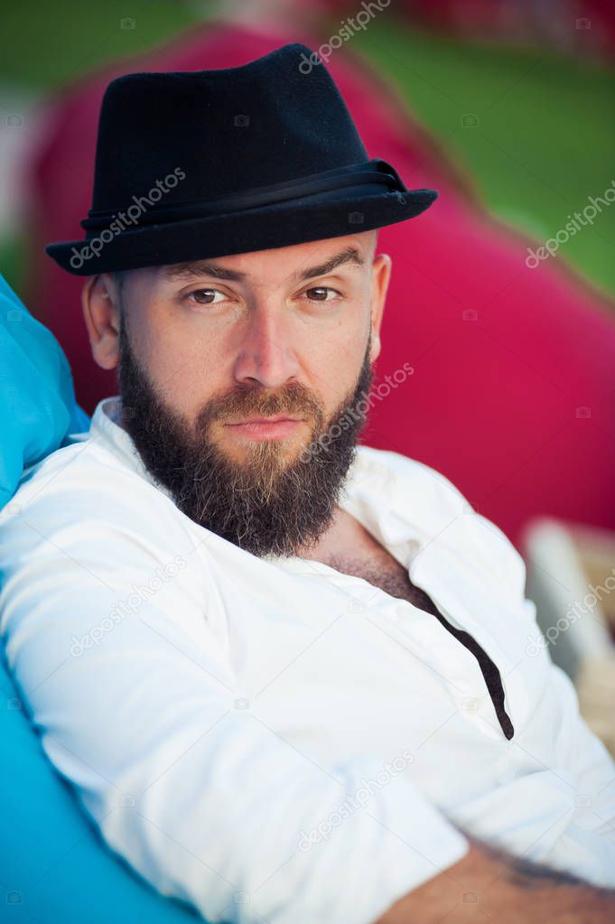 Stylish bearded man in hats. Men`s style
