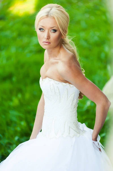 Beautiful sensual bride blonde in wedding dress