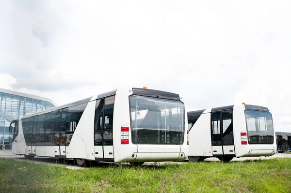 buses   near the airport building