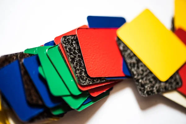 Color swatches powder coatings on metal profiles, on a white background