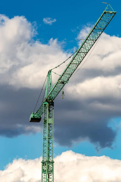 A crane is a type of machine, generally equipped with a lifting rope, wire ropes or chains and pulleys, which can be used both to lift and lower the materials and to move them horizontally.