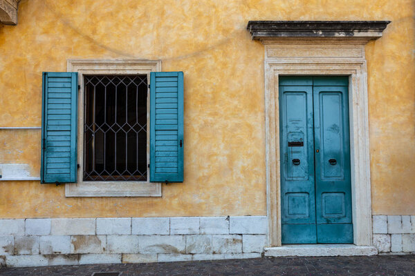 Windows in the facades of ancient Venetian houses