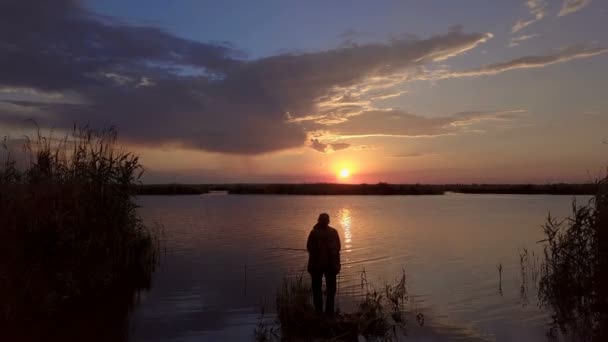 Fisherman and the setting sun — Stock Video