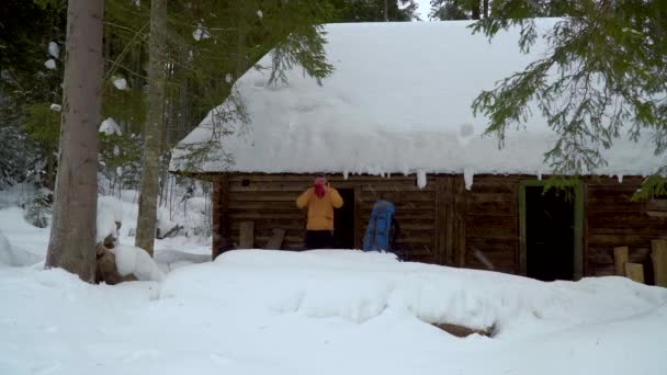 Backpacker hiking in winter forest — Stock Video