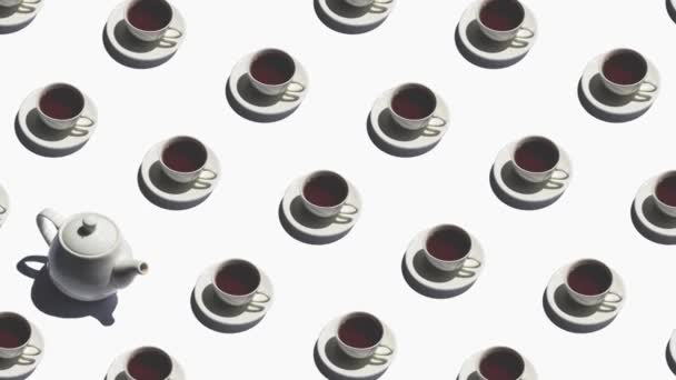 Modèle avec théière solitaire et de nombreuses tasses de thé animé sur fond blanc — Video