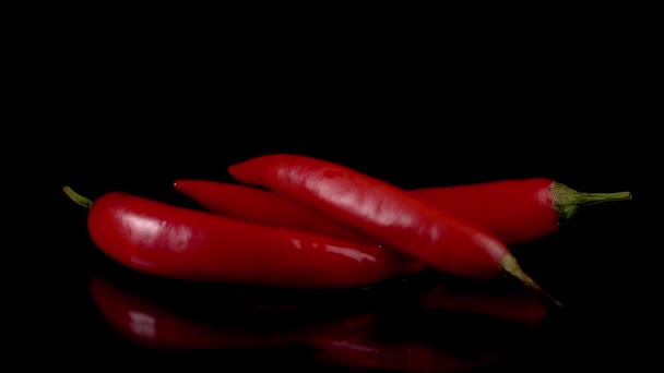 Hot red chili peppers in flames burn — Stock Video