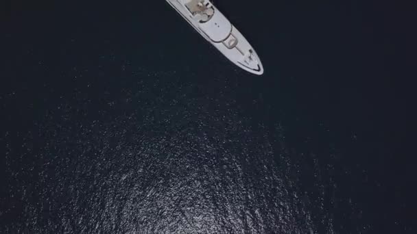 Top view of a drone on a luxury yacht at sea. — Stock Video