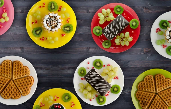 cakes, cookies waffles on the table. dessert for a festive table. sweets view from above