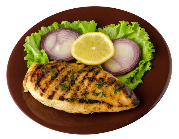 grilled chicken fillet with vegetables (lemon, salad, onion) isolated on white background. chicken fillet grilled on a plate top view